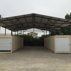 Shipping containers creating car port