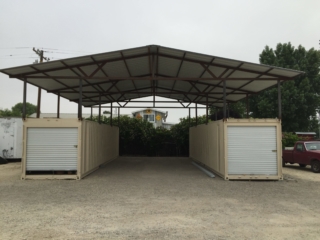 Shipping containers creating car port