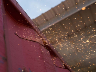 Cutting out section of shipping container for a door or window