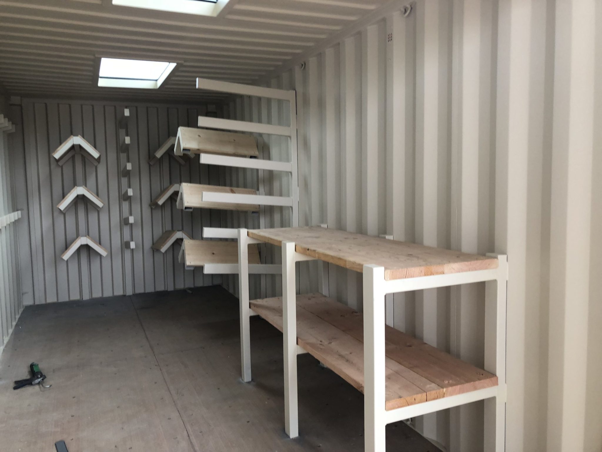 Shipping container with customized work bench